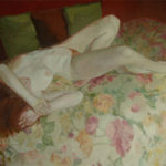 Large nude on flowered bedspread
